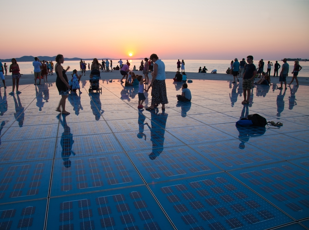 A sunset with dozens of people in Zadar