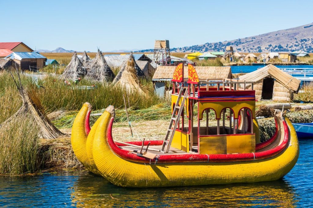 Floating Grass on the Uros islands with a yellow boat