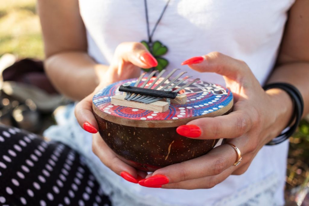 A woman playing Mbira