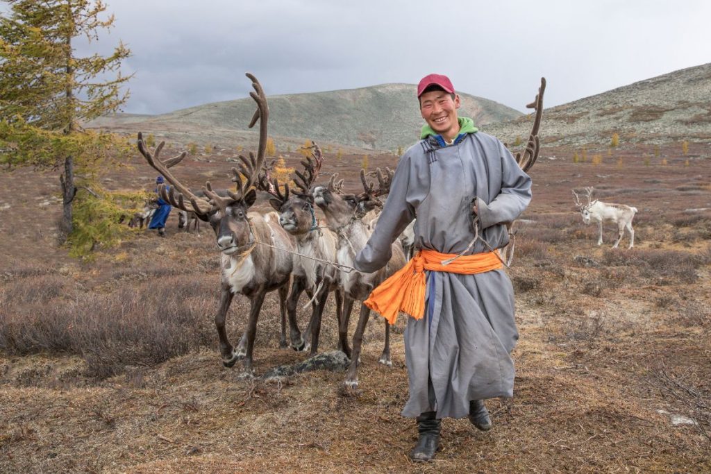 23 Fun Facts About Mongolia's Culture And Geography 6 Man with Traditional Mongolian Attire and raindeer