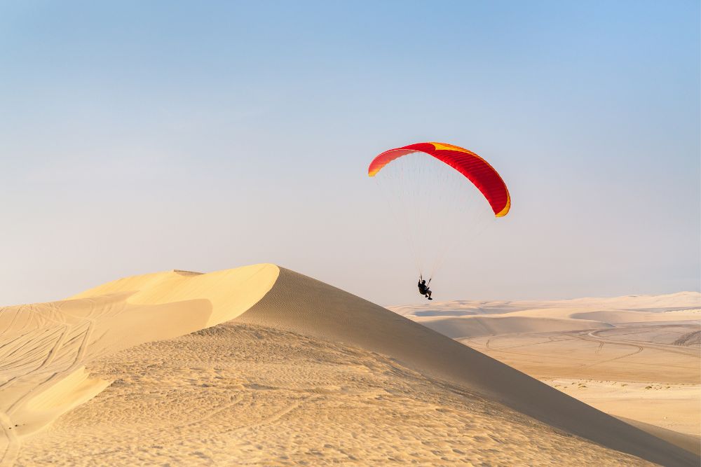desert with paraglider in Qatar