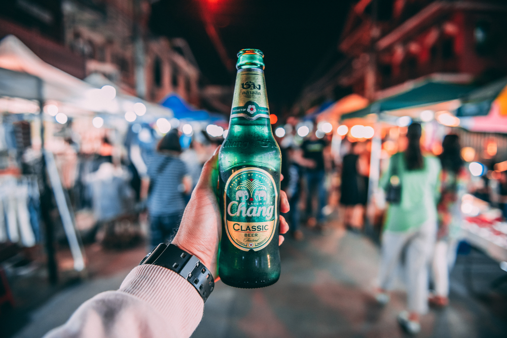 15 Fun Facts About Thailand From The Land of Smiles 4 Hand holding Chang beer on Thailand street at night